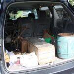 open trunk of an SUV full of antique items from an antiquing trip in Adamstown PA.