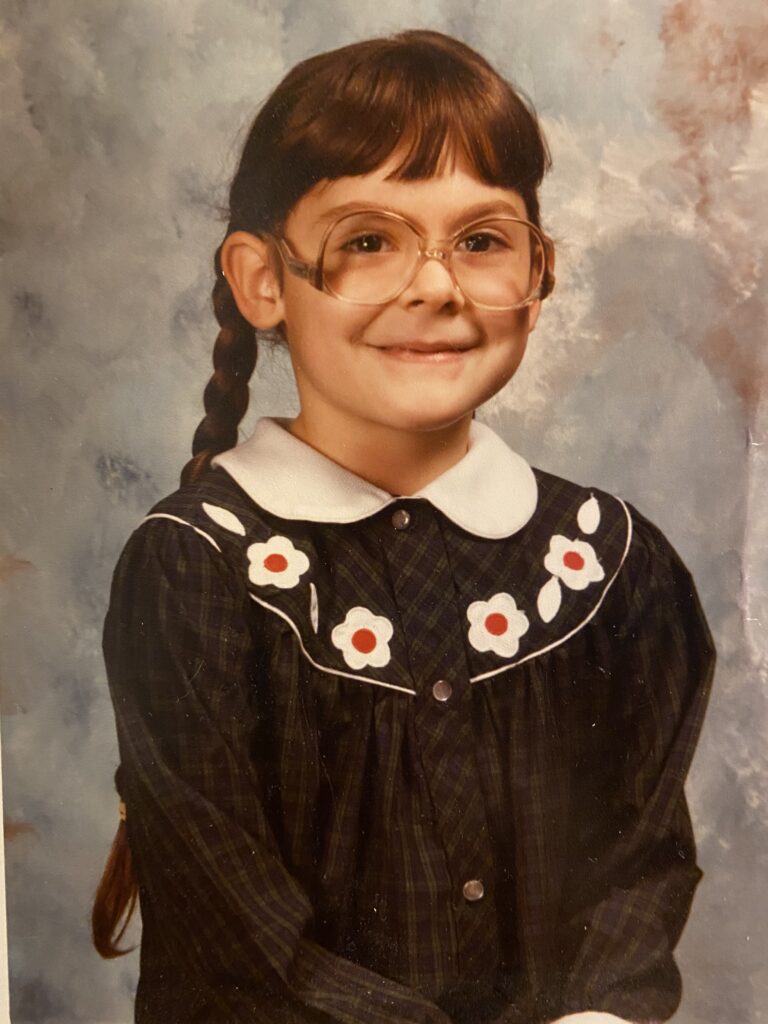 Kindergarten school photo of Amanda Gendek, owner of One Cozy Nest, a vintage crafting business.