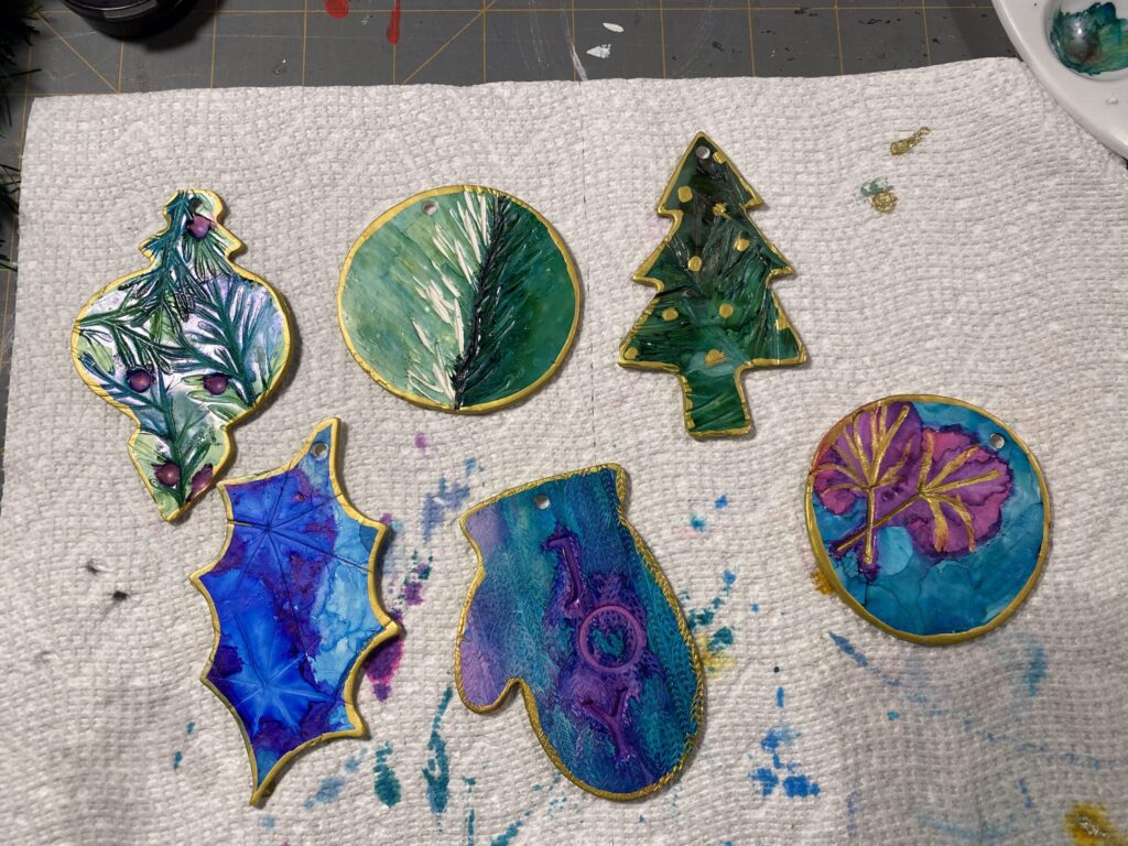 decorate polymer clay ornaments with acrylic paint or alcohol ink to bring out the texture of your nature impressions