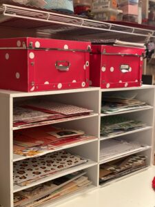 white shelves full of colorful scrapbook paper